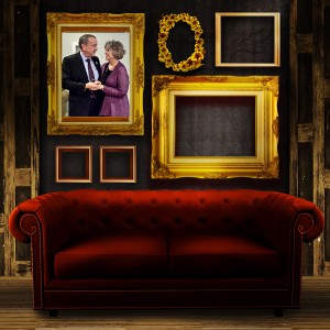 Gallery display - vintage gold frames on an old timber wall and red sofa